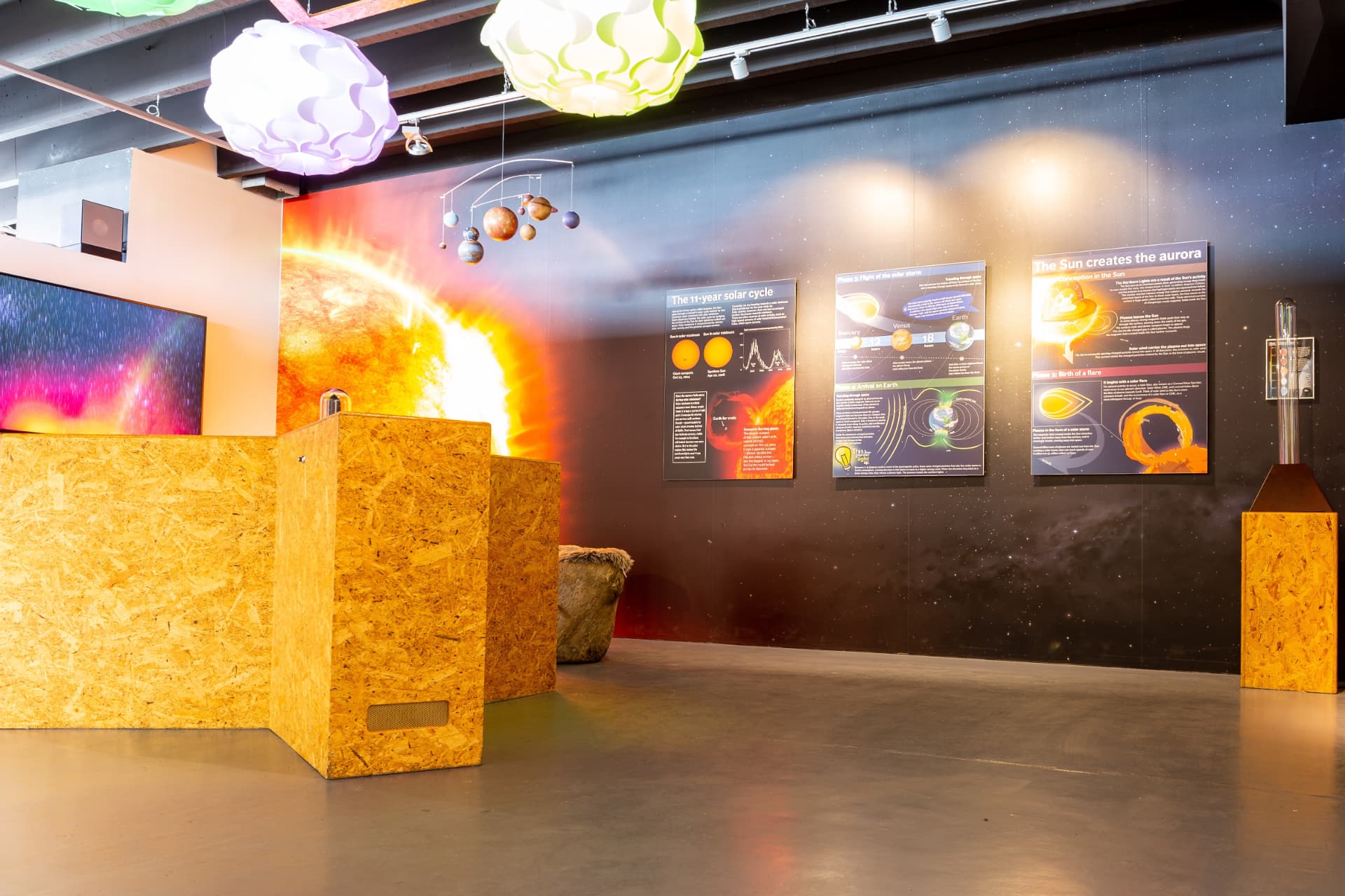 Aurora science exhibit explaining how the Sun creates the Northern Lights